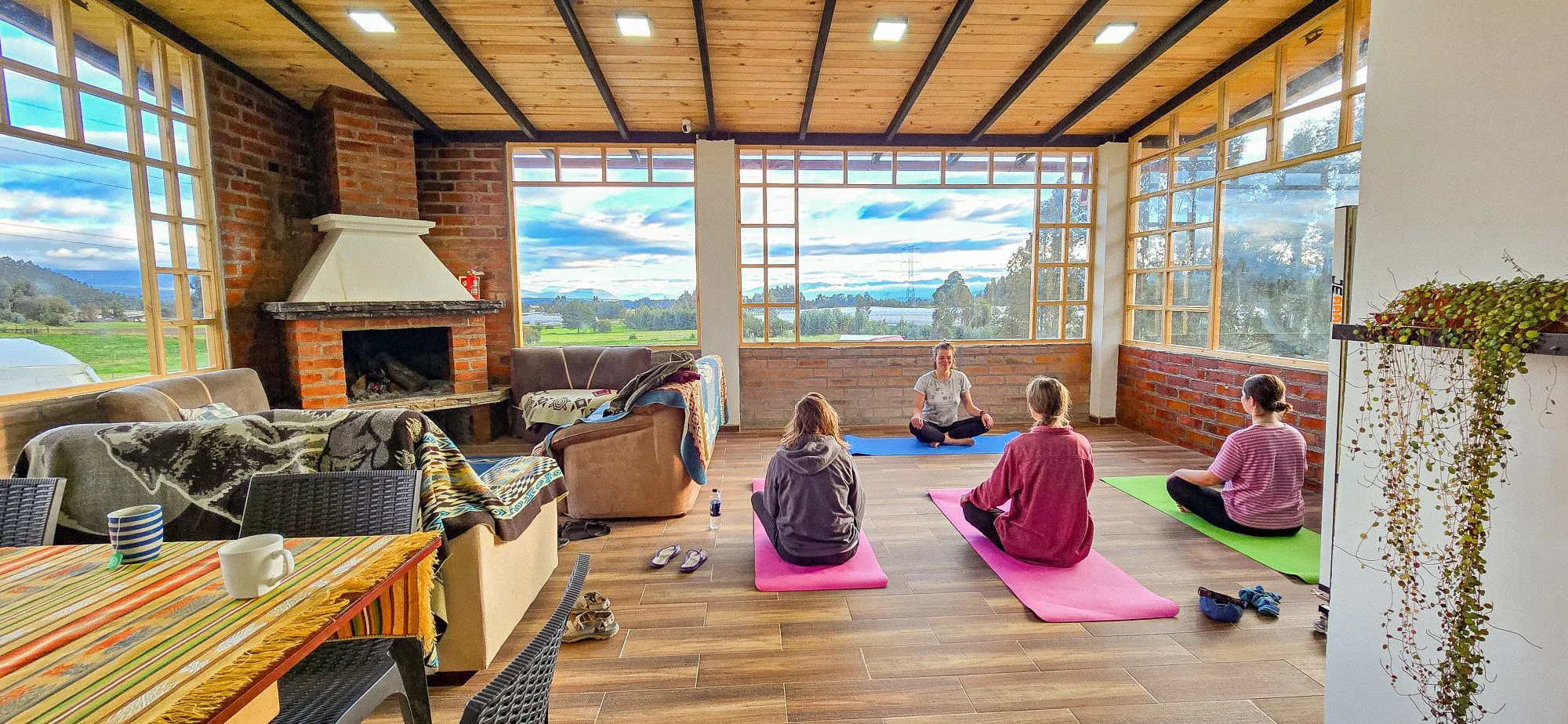 Yoga session in Cuscungo's panoramic common room